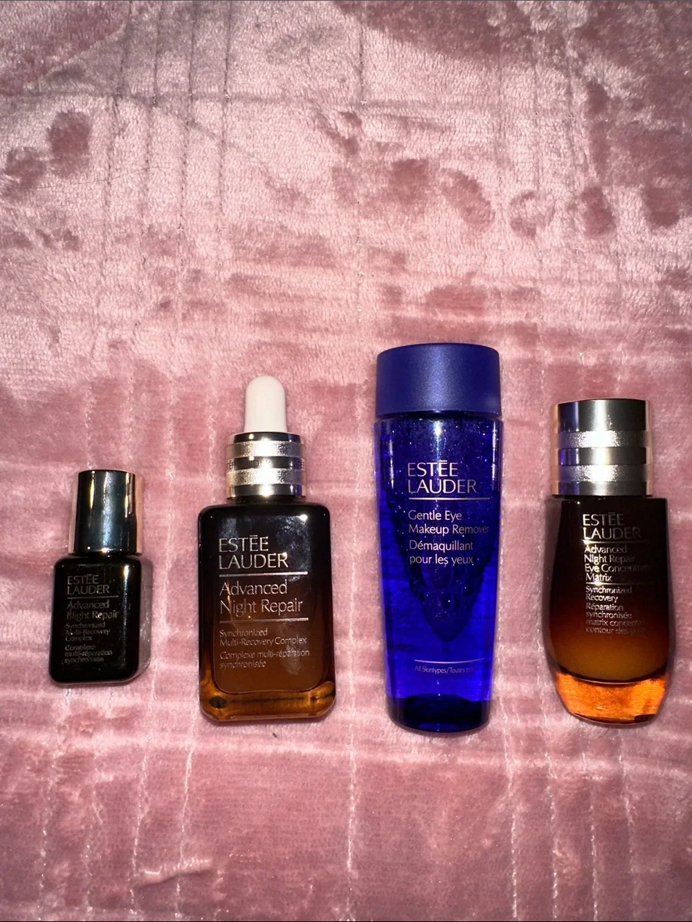 Estee Lauder Skincare Assortment with Blue, Pink, Gold and Brown Accents